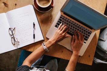 Stocksy_woman-writing-laptop_476082-57ab432d3df78cf459975331